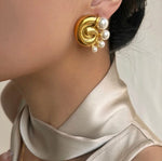 Pearl snail statement stud earrings