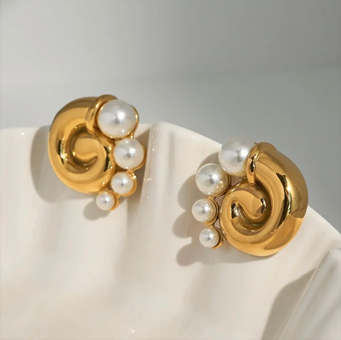 Pearl snail statement stud earrings